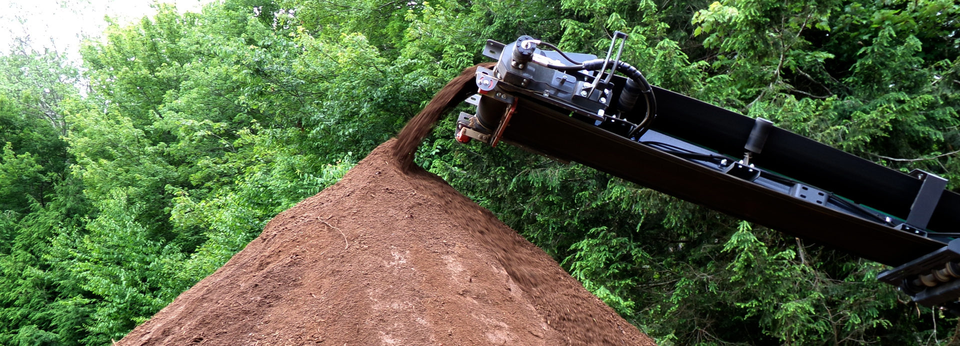 Conveyor pouring premium topsoil at Semonick Acres