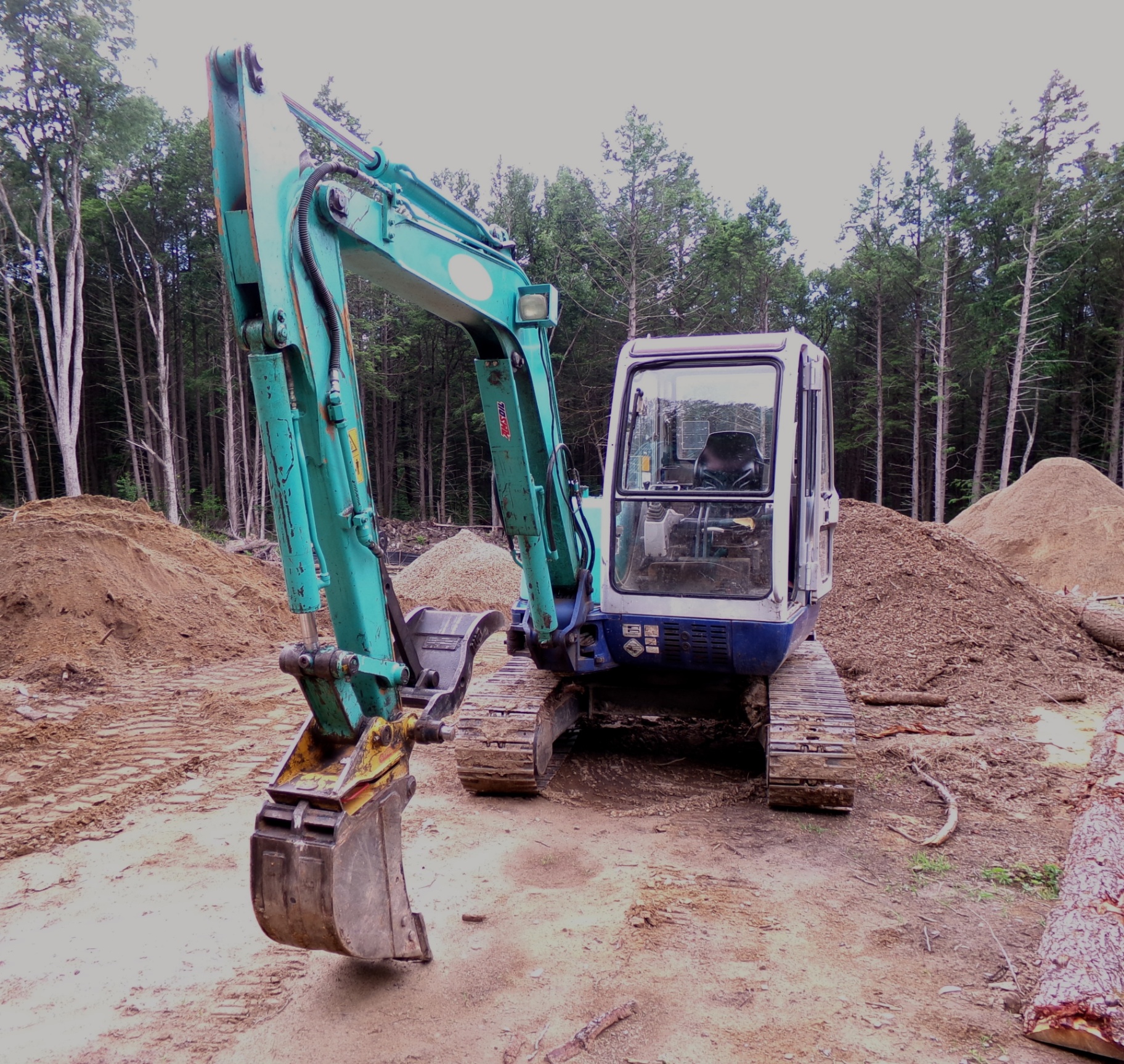 Mini excavator on a job site
