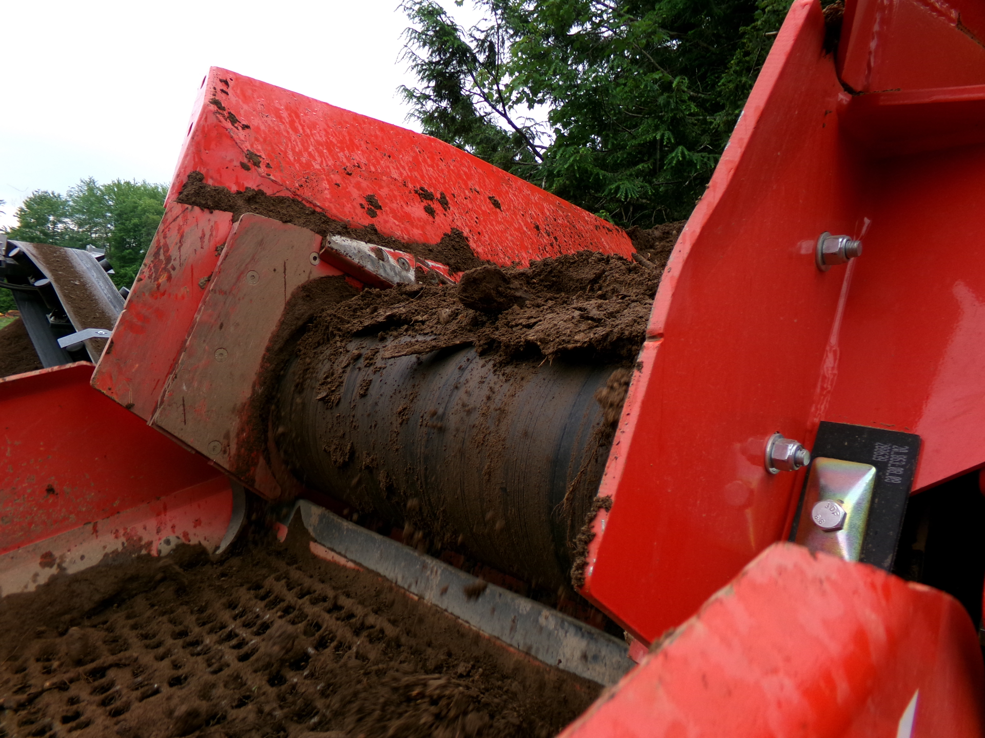 Screened material moving down the belt